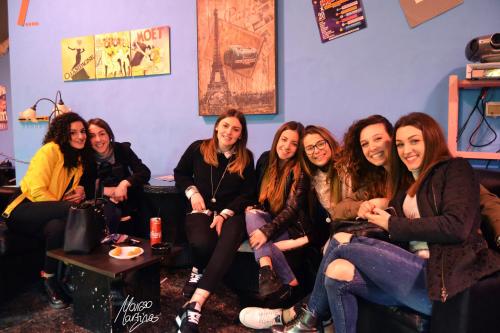 a group of women sitting in a room at Ostello Salento in Alezio