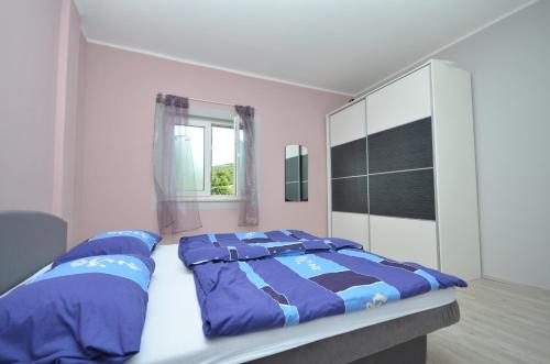 Postel nebo postele na pokoji v ubytování Blue House Sibenik