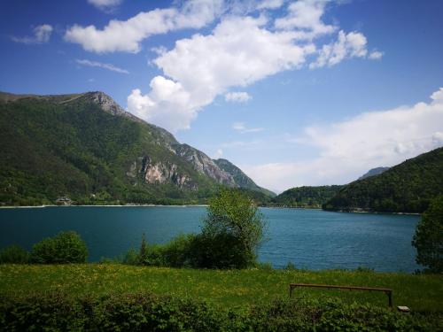 a view of a lake with mountains in the background at Appartamento Chiara in Ledro