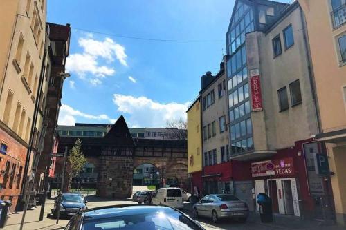 a car parked on a city street with buildings at Hostel "Berkut" in Nuremberg