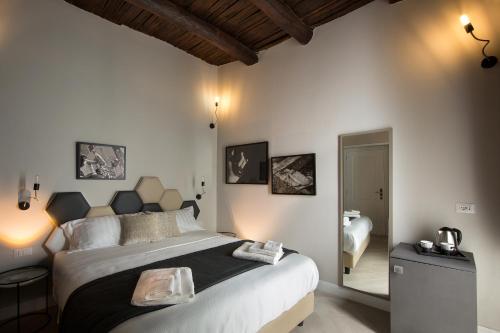 a bedroom with a large bed in a room at Naplesuite in Naples