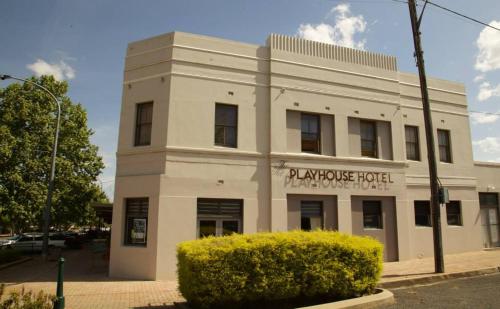 a large white building with a sign on it at The Playhouse Hotel in Barraba