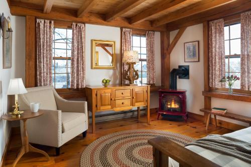 a living room filled with furniture and a fireplace at Seven Sea Street Inn in Nantucket