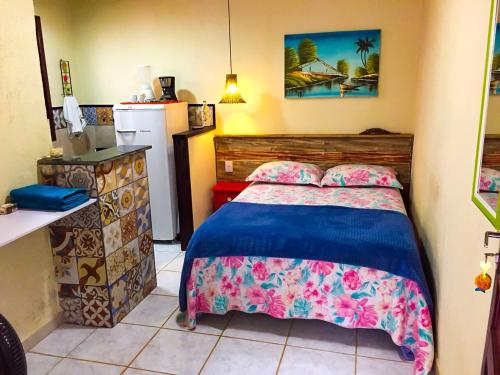 Giường trong phòng chung tại Flat aluguel Abraão 2,Ilha Grande