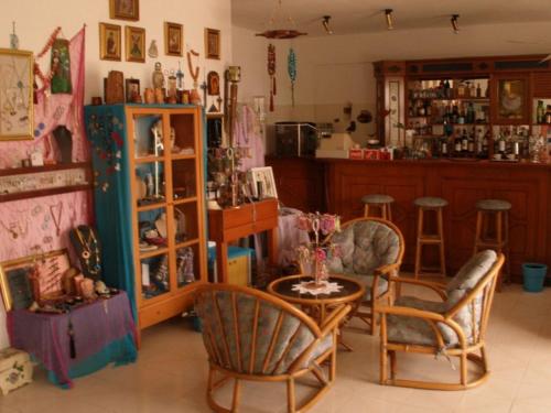 a living room with two chairs and a table at Hotel Alexandros in Ormos Panagias