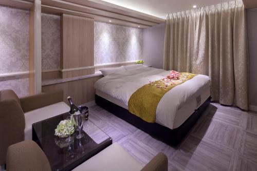 Postel nebo postele na pokoji v ubytování ホテルオリジン Hotel Origin 男塾ホテルグループ