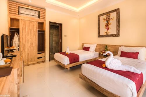 Postel nebo postele na pokoji v ubytování Bliss Ubud Abangan
