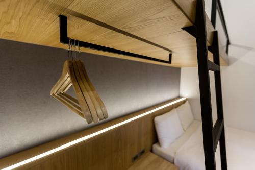 a room with a bed and a light hanging from the ceiling at Green Hotel in Magong