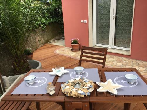 a wooden table with stars and plates on it at Albamare in Monterosso al Mare