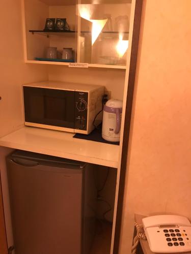 Η κουζίνα ή μικρή κουζίνα στο Hotel Tiffany (Adult Only)