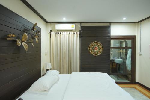 Ένα ή περισσότερα κρεβάτια σε δωμάτιο στο Sunny V Hotel