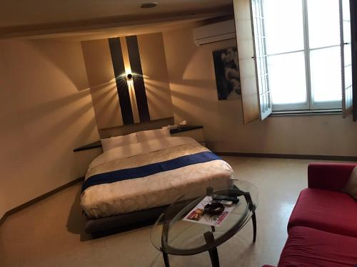 Ένα ή περισσότερα κρεβάτια σε δωμάτιο στο Hotel Tiffany (Adult Only)