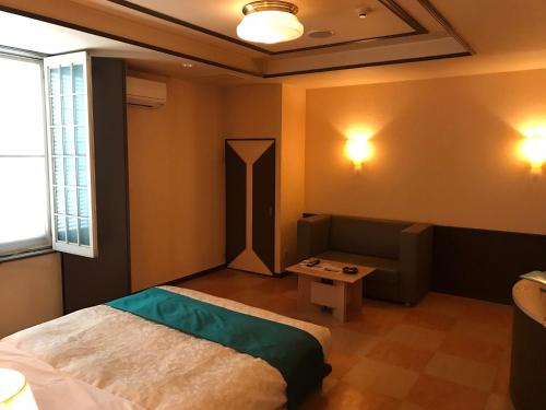 Ένα ή περισσότερα κρεβάτια σε δωμάτιο στο Hotel Tiffany (Adult Only)