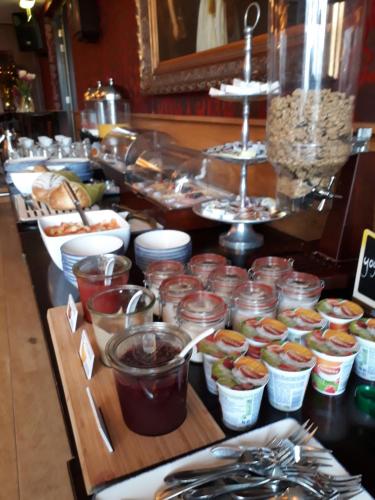 a buffet line with many different types of food at Hotel Restaurant de Engel in Lisse