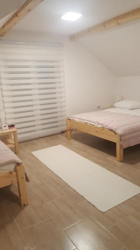 Postel nebo postele na pokoji v ubytování Pansion i Restoran ,, POGLED"