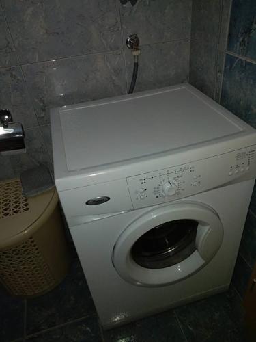 a washer and dryer in a small bathroom at Apartment Bogdan in Banja Koviljača