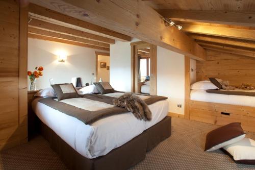 a bedroom with a large bed in a room at Chalet Marin in Le Grand-Bornand