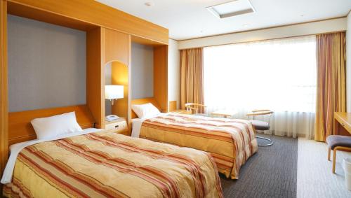 Hotel Laforet Nasu tesisinde bir odada yatak veya yataklar