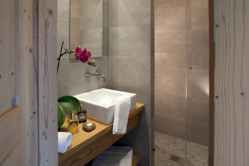 a bathroom with a sink and a shower at Chalet Marin in Le Grand-Bornand