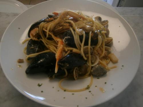 a white plate of food with noodles and vegetables at Camping Klaus in Cavallino-Treporti