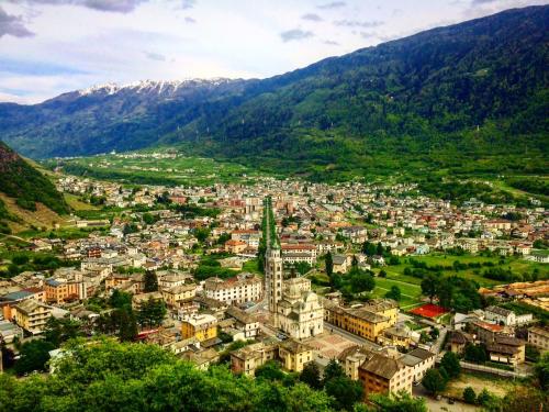 an aerial view of a city in the mountains at Casa Vacanze Santa Perpetua in Tirano