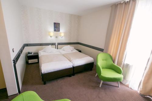 Ένα ή περισσότερα κρεβάτια σε δωμάτιο στο Hotel International