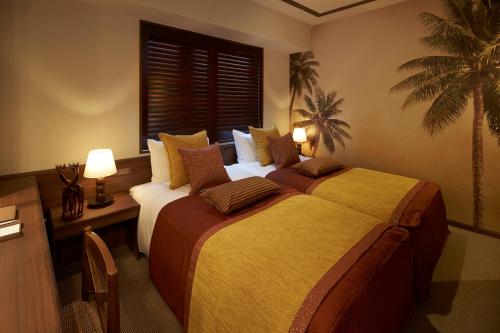 Postelja oz. postelje v sobi nastanitve DEL style Osaka Higashi Temma by Daiwa Roynet Hotel