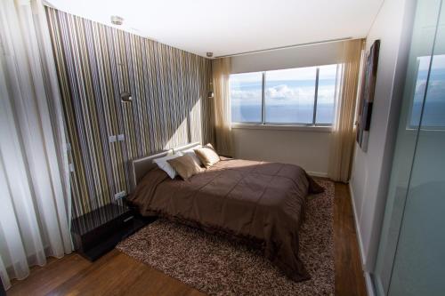 Кровать или кровати в номере OurMadeira - Fonte do Mar 1, premium