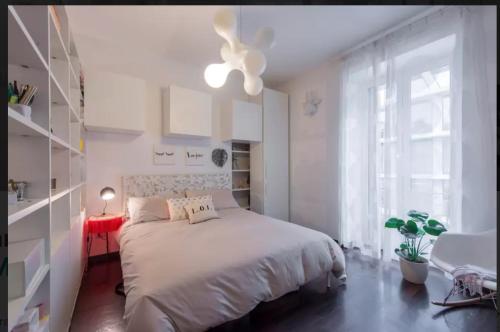 Postel nebo postele na pokoji v ubytování Lovely apartment in the heart of Milan
