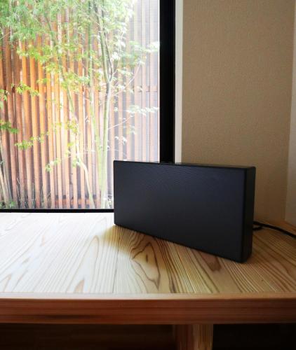 a laptop sitting on a table in front of a window at ORI stay and living in Kyoto