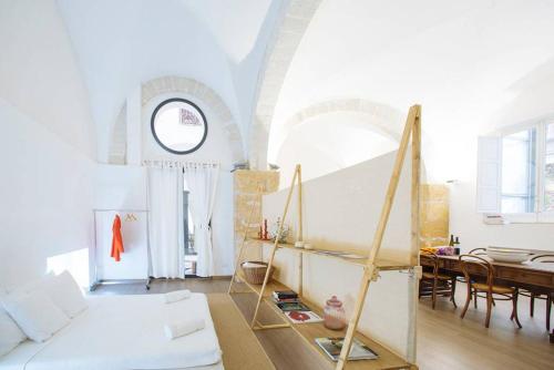 a living room with a couch and a table at Paolo & Francesca's Trapani Loft in Trapani
