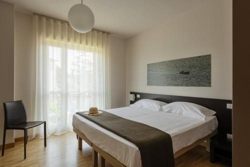 Krevet ili kreveti u jedinici u okviru objekta Vialeromadodici Rooms & Apartments