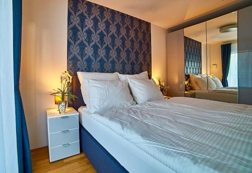Säng eller sängar i ett rum på Best Place Apartments Vienna