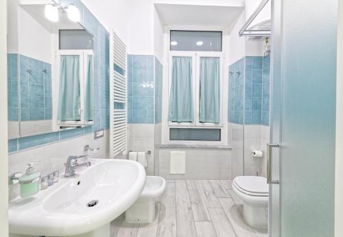 a bathroom with a sink and a toilet at B&B Rest a Napoli in Naples