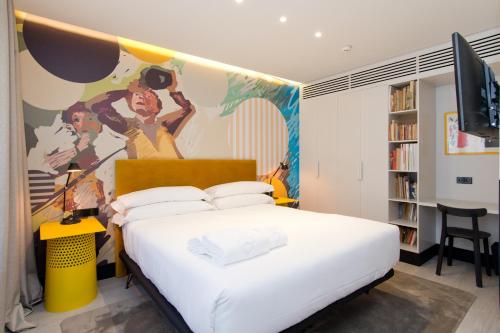 Łóżko lub łóżka w pokoju w obiekcie Amor de Dios 17 Boutique Apartments