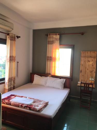 Ένα ή περισσότερα κρεβάτια σε δωμάτιο στο Thao Trang Hotel