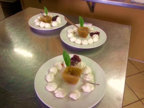 three plates of food on a table with desserts at L'Uliveto in Reitano
