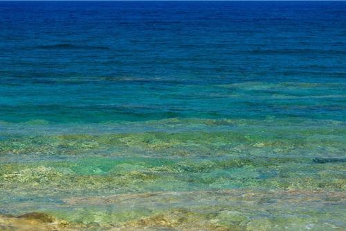 a large body of water with the ocean in the background at Villa Menelaos in Mochlos