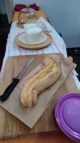a banana sitting on top of a table with a knife at Villa Rosa in Modica