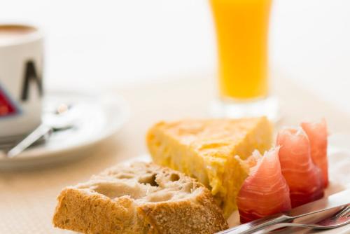 a plate of food with a piece of bread and sushi at Rio Sil Carballo in Carballo