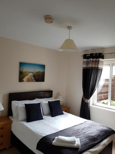 a bedroom with a large bed and a window at Courthouse View in Carrick on Shannon