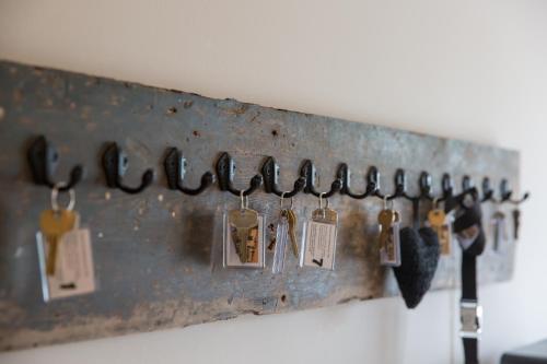 a bunch of keys hanging on a wall at De Herberg in Renesse
