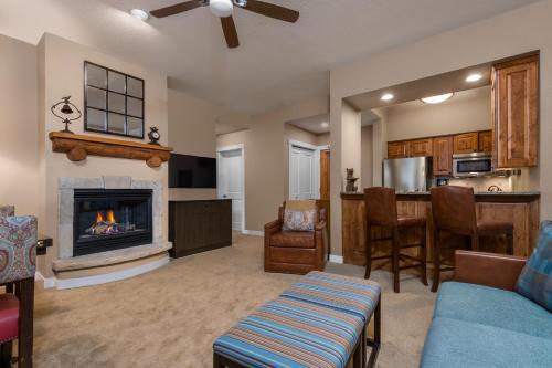 a living room with a couch and a fireplace at The Residences at Mountain Lodge by Hyatt Vacation Club in Beaver Creek