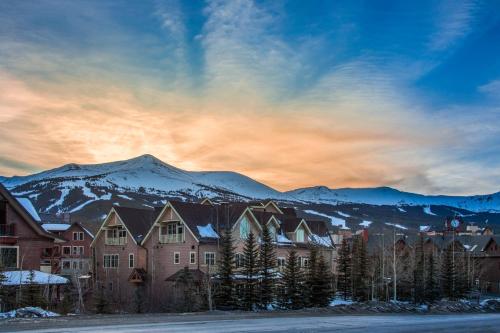 a group of houses with mountains in the background at The Residences at Main Street Station by Hyatt Vacation Club in Breckenridge