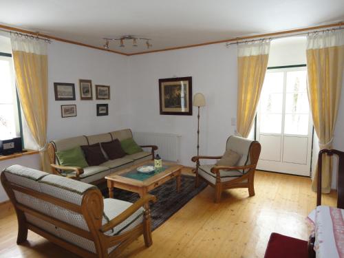 a living room with a couch and chairs and a table at Lindenhof in Murau