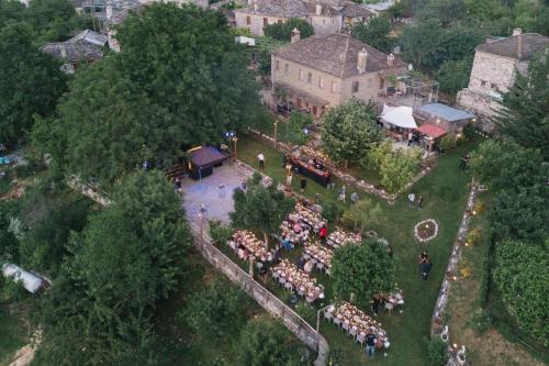 an aerial view of a gathering of people in a park at Kalliopi in Papingo
