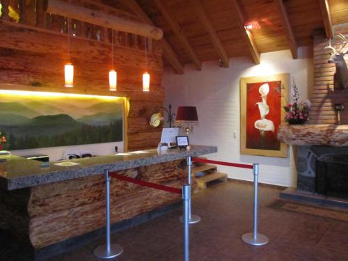 a room with a stone counter and a fireplace at Cabañas Sierra Mazamitla in Mazamitla