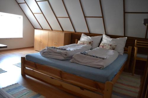 two twin beds in a room with a roof at Chalupa Hanuliak in Terchová