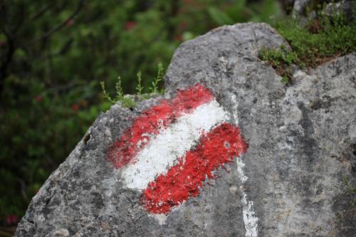 a red and white stripe on a rock at Pension INGE in Hinterstoder