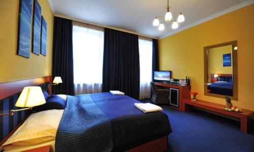 Una cama o camas en una habitación de Hotel Arte